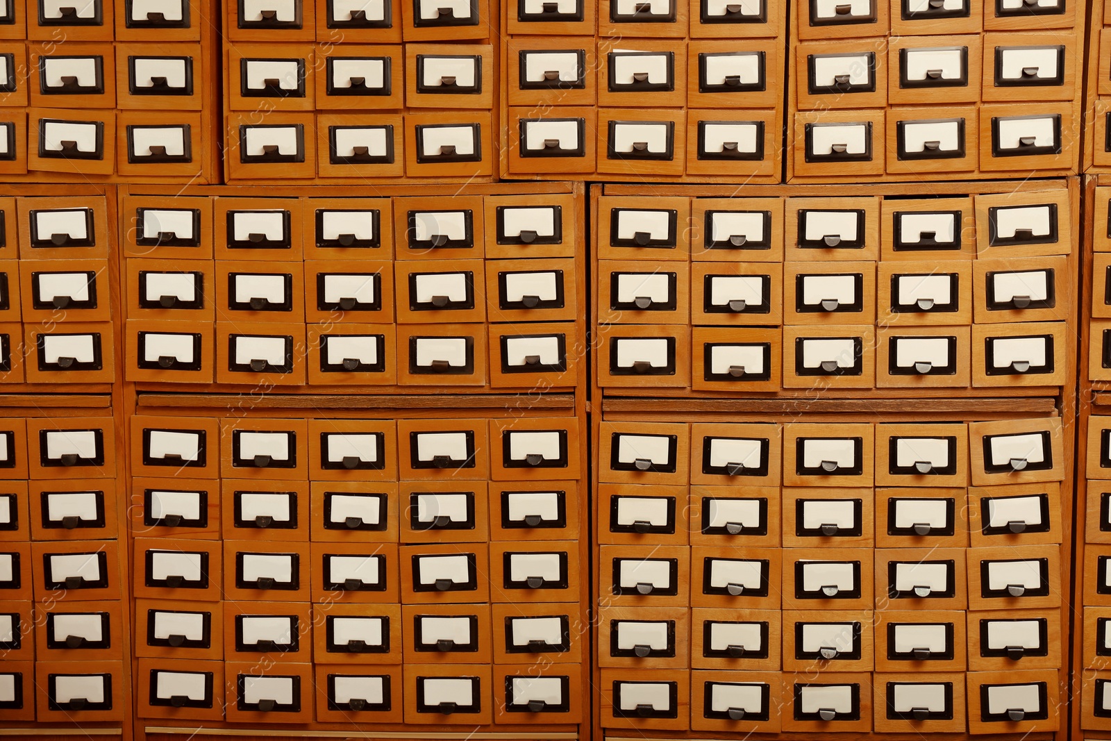 Image of Many library card catalog drawers as background