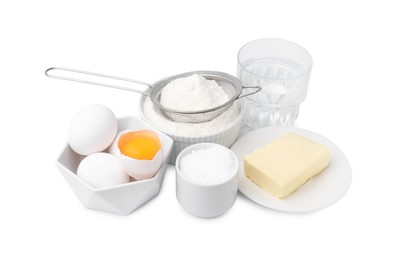 Photo of Eggs, butter, flour, salt and water isolated on white. Ingredients for puff pastry dough