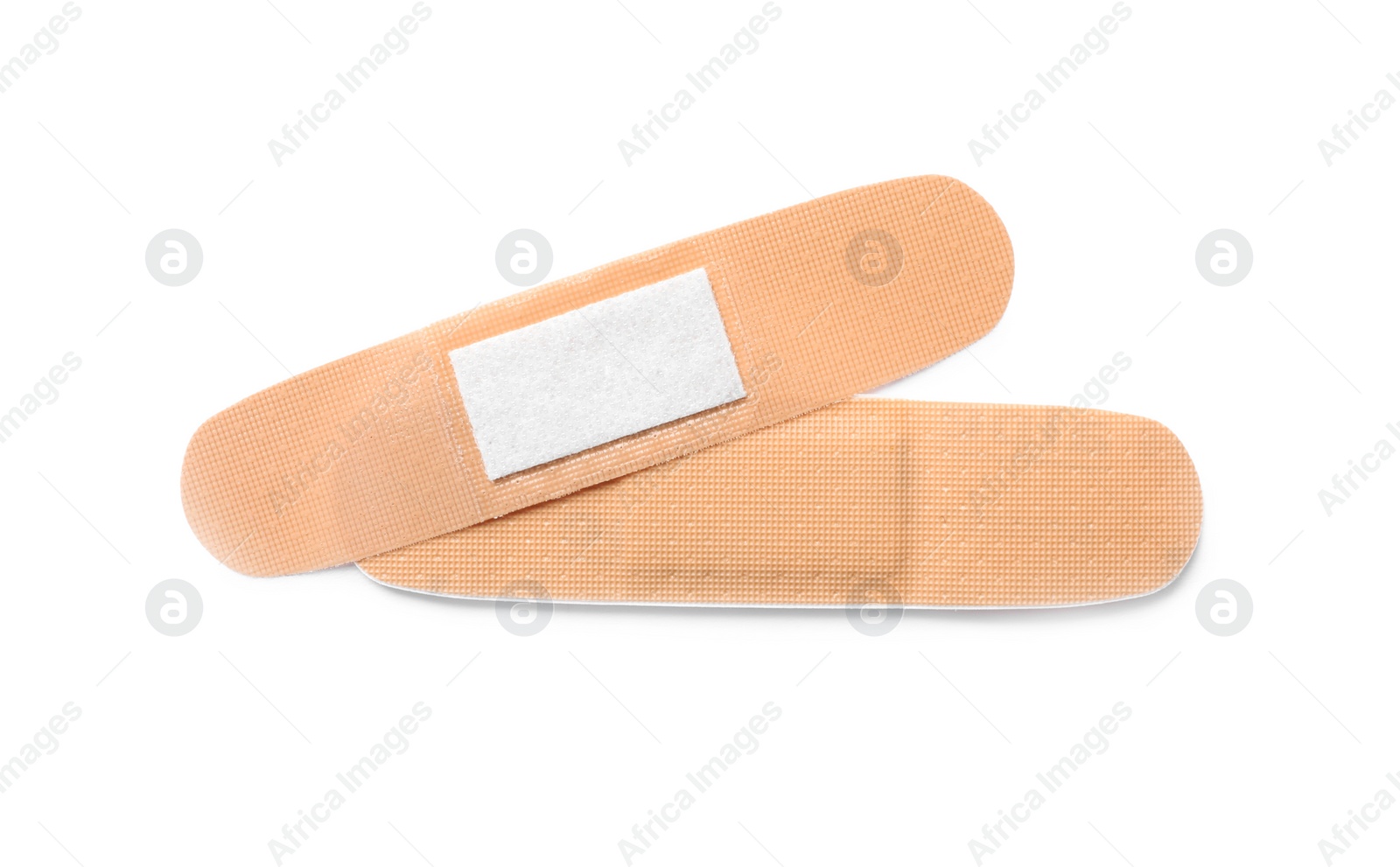 Medical sticking plasters isolated on white. First aid item Photo of Medical sticking plasters isolated on white. First aid item