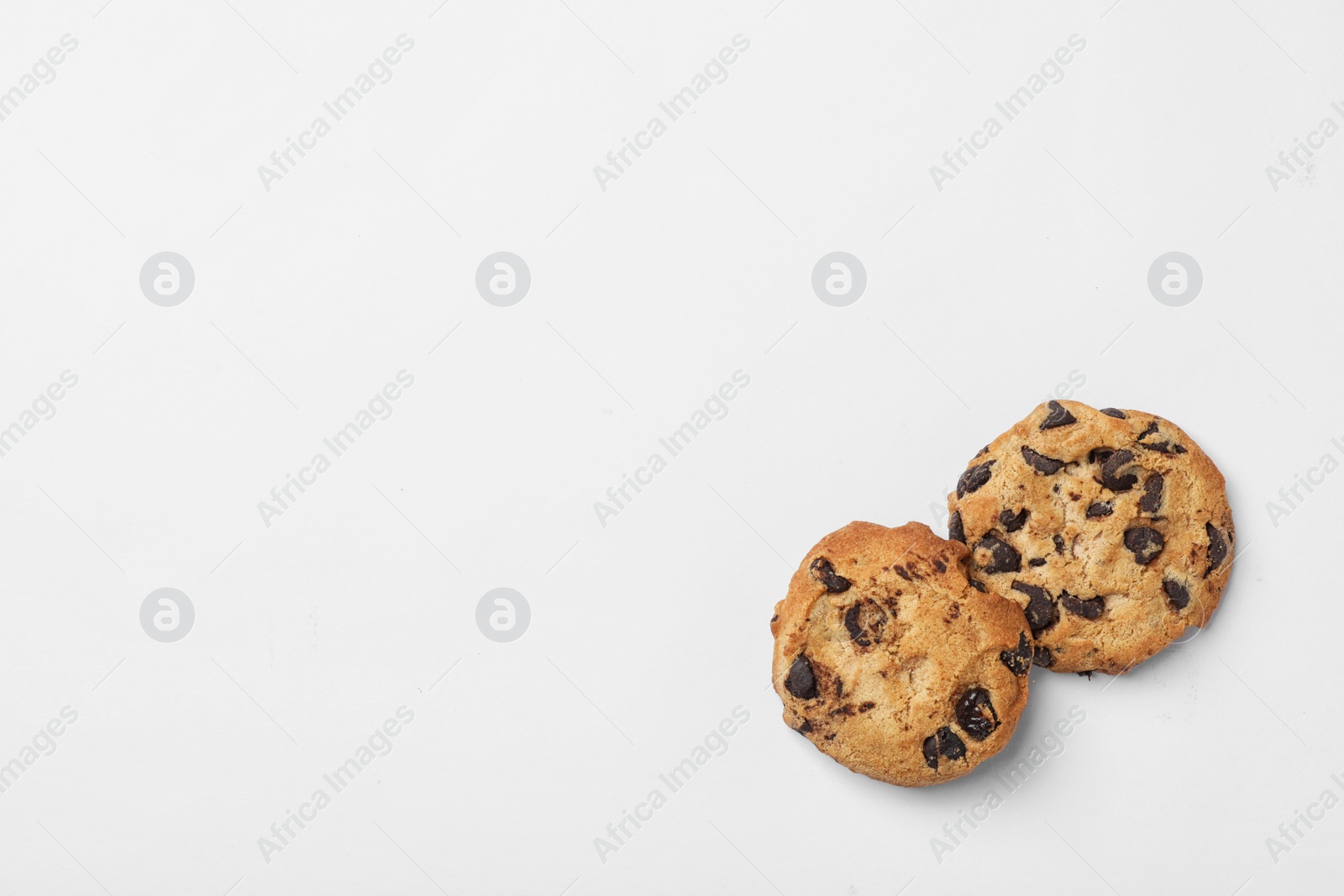 Photo of Flat lay composition with chocolate cookies and space for text on white background