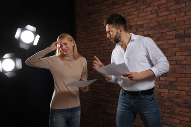 Photo of Professional actors rehearsing on stage in theatre