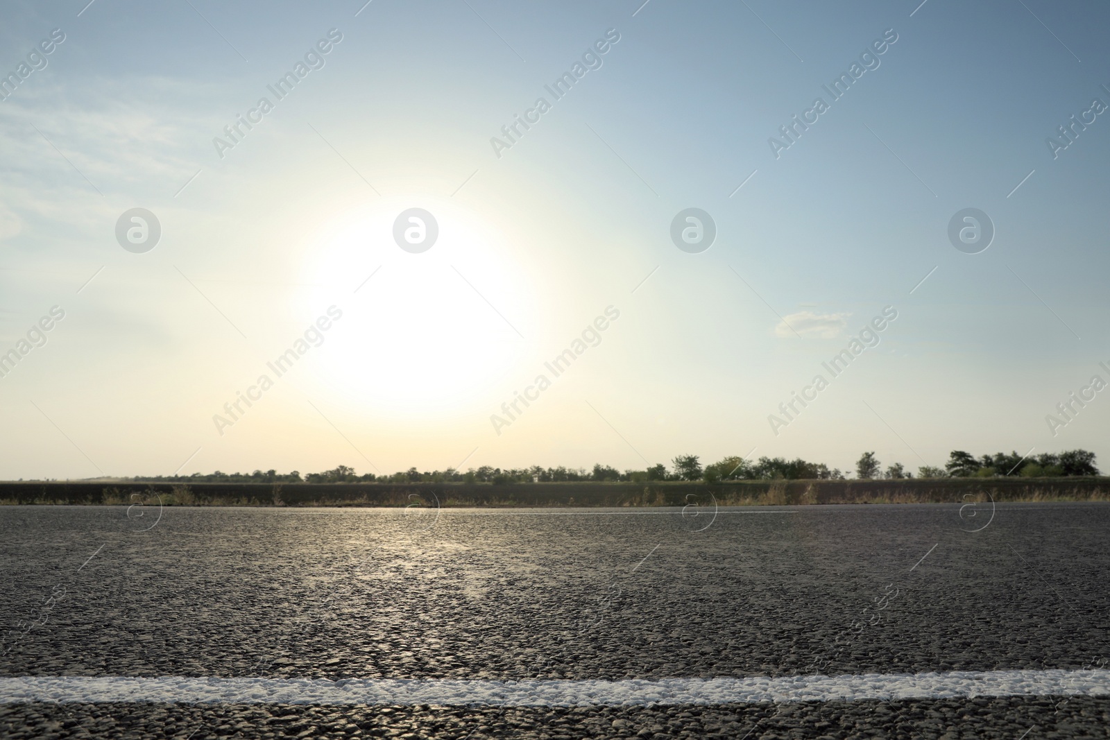 Photo of Beautiful view of empty asphalt highway on sunny day. Road trip