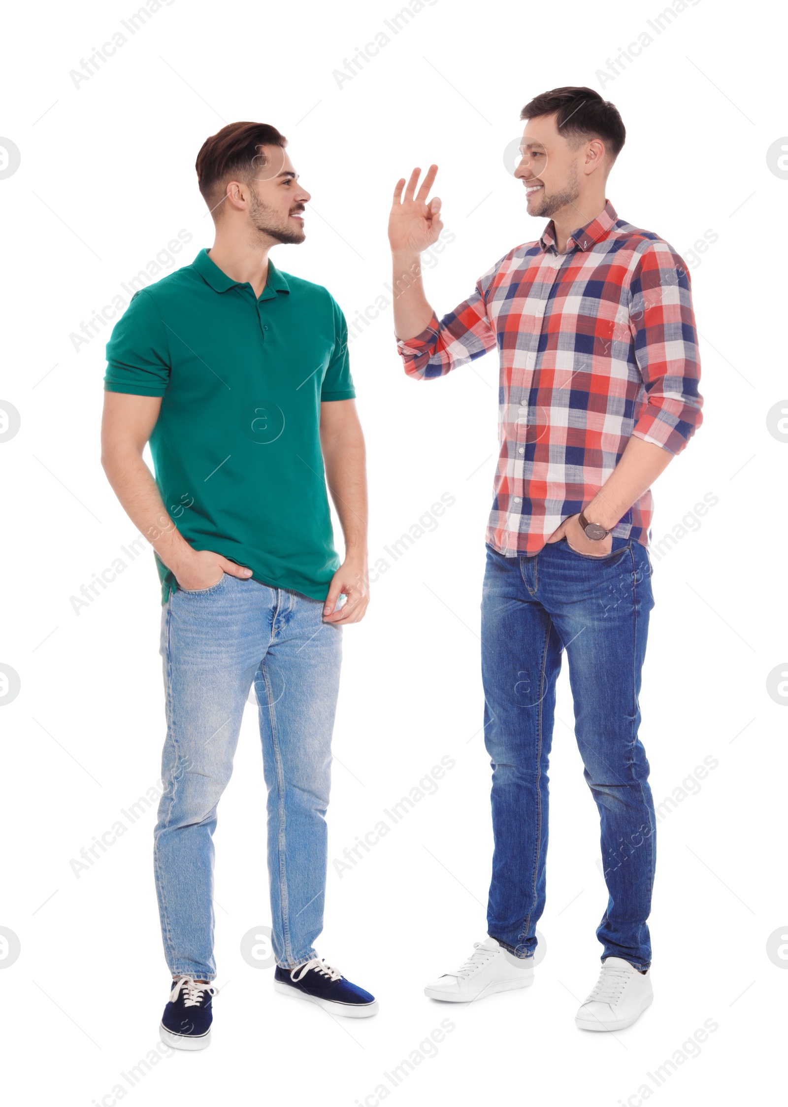 Photo of Hearing impaired friends using sign language for communication isolated on white