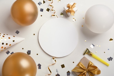 Photo of Flat lay composition with party accessories and space for text on light background