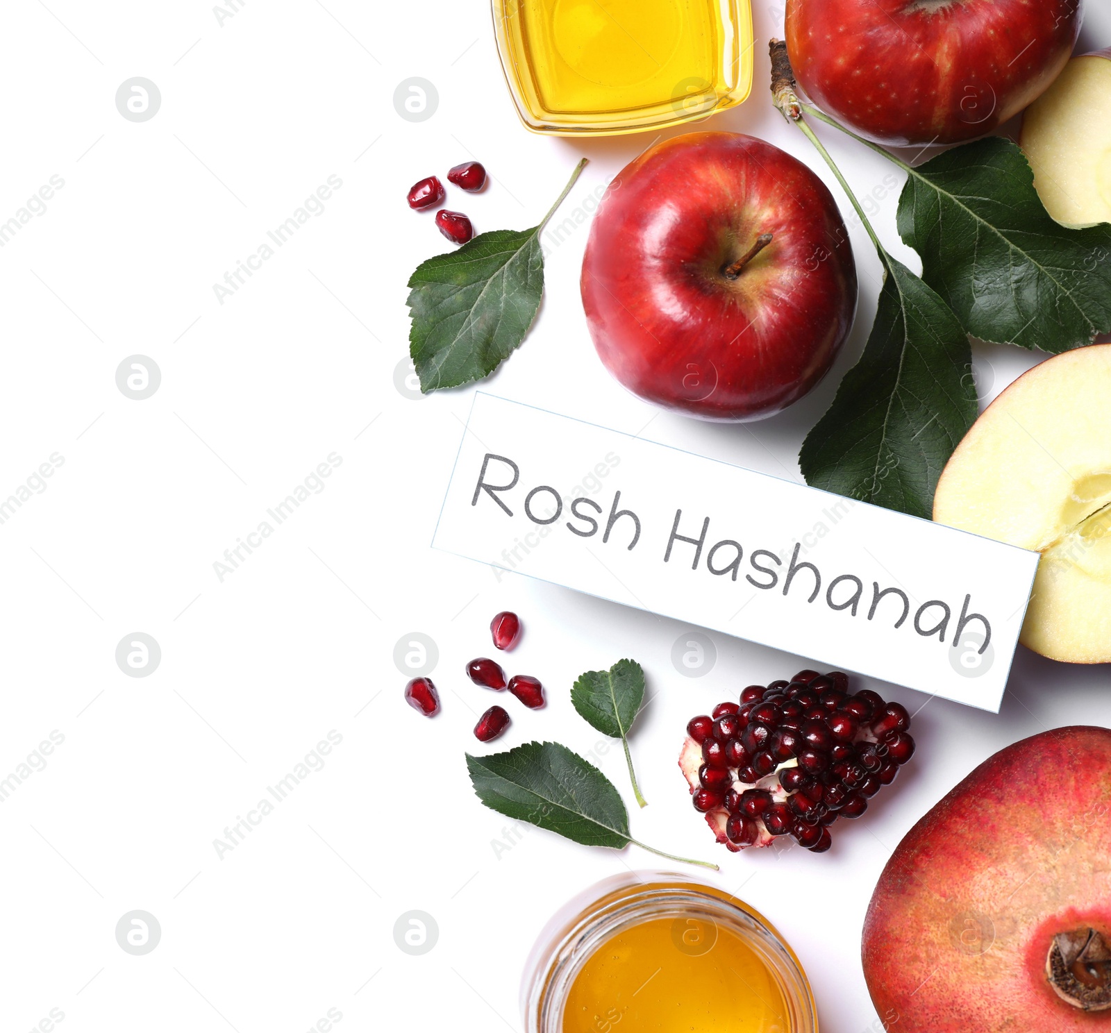 Photo of Card with text ROSH HASHANAH, apples, honey and pomegranates on white background, flat lay