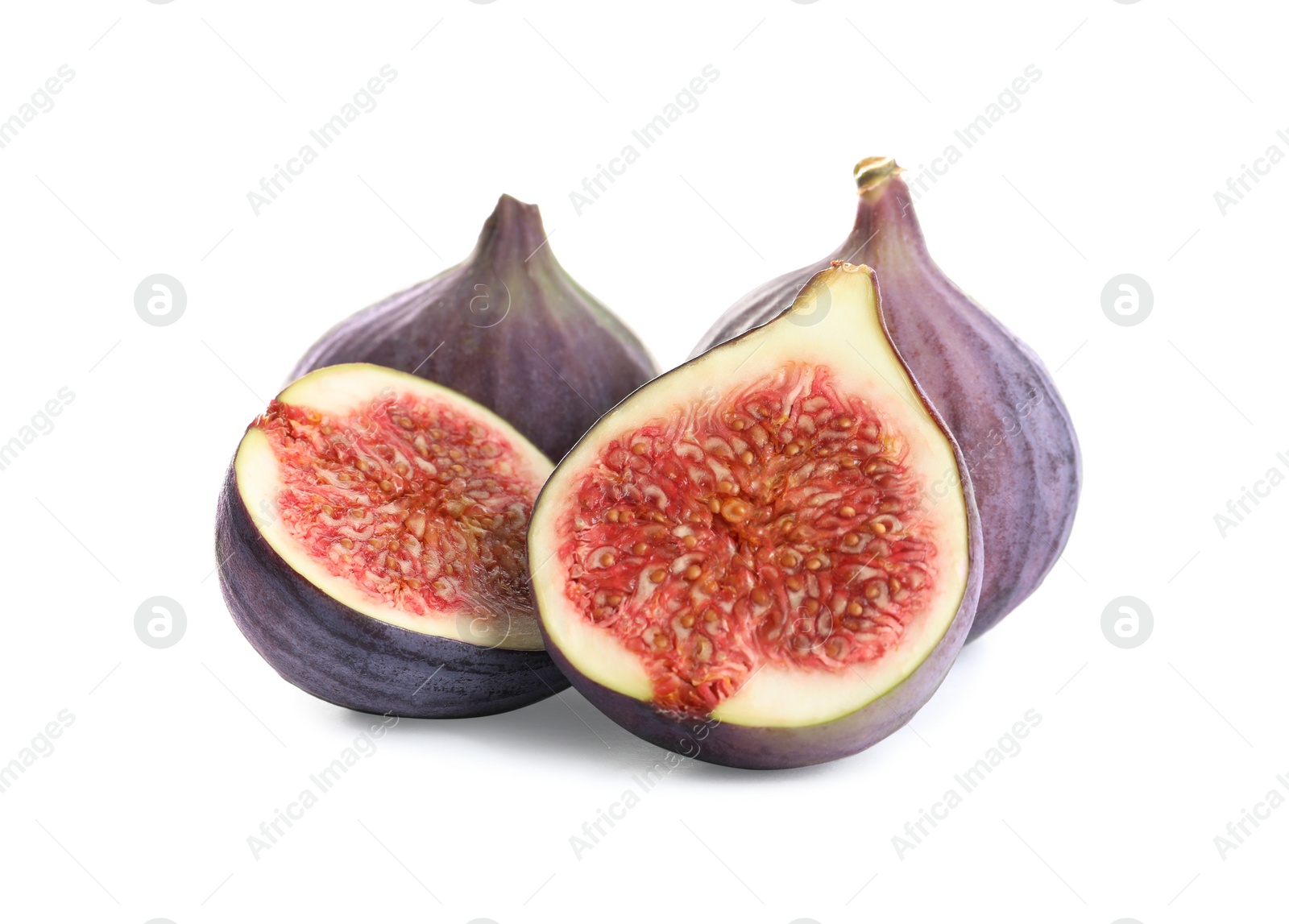 Photo of Whole and cut purple figs on white background