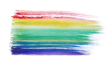 Photo of Rainbow paint stroke drawn with brush on white background, top view