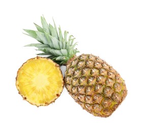 Photo of Whole and cut tasty ripe pineapples isolated on white, top view