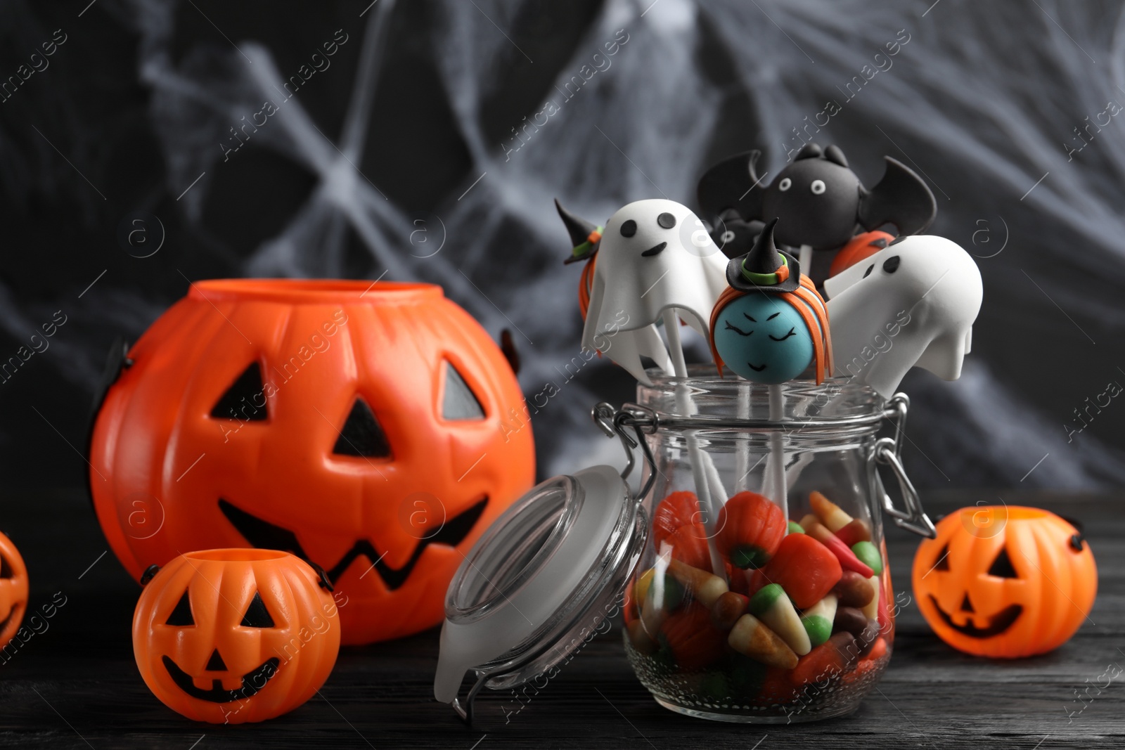 Photo of Different Halloween themed cake pops on black table