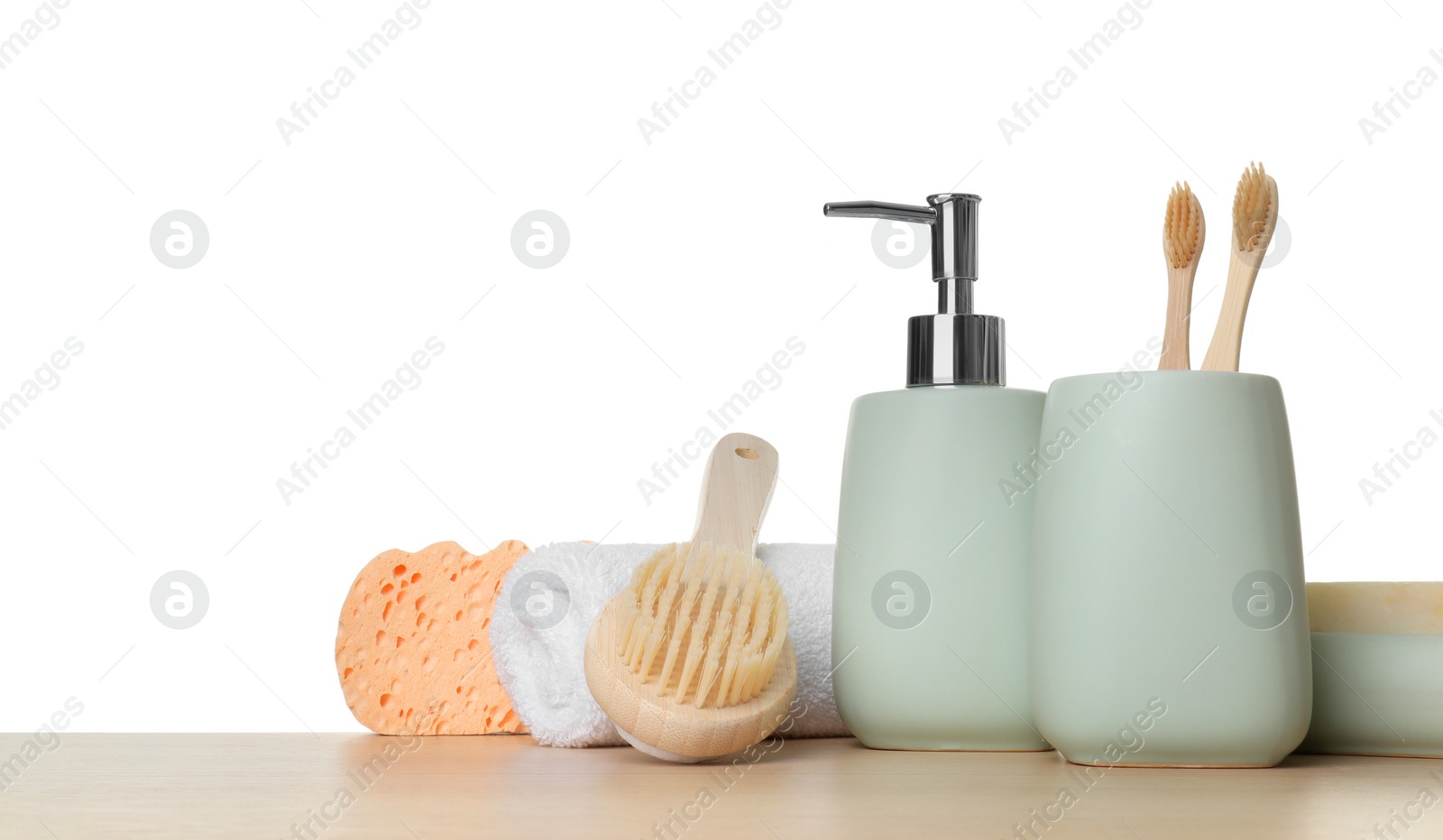 Photo of Bath accessories. Different personal care products on wooden table against white background. Space for text