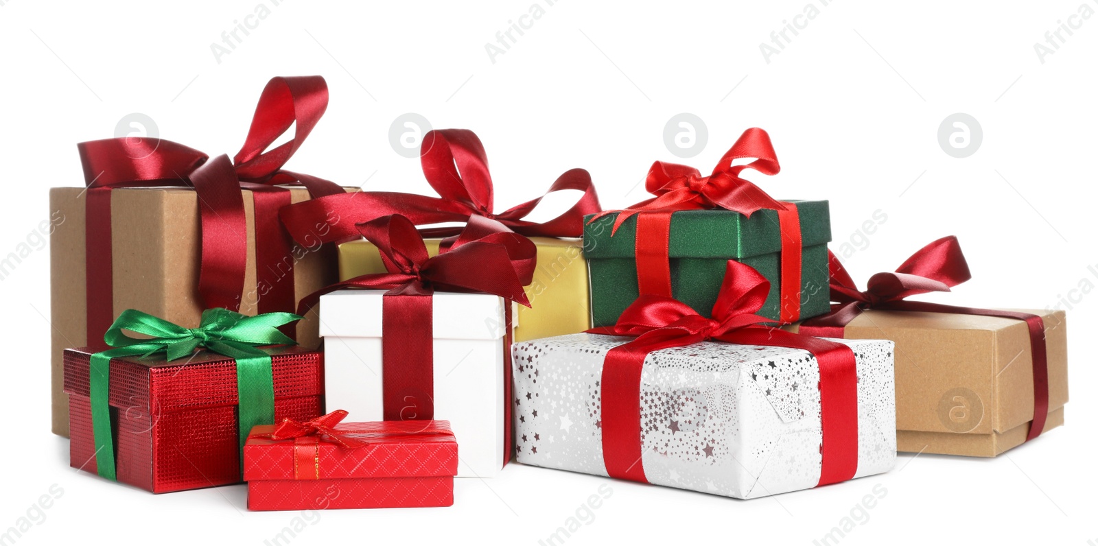 Photo of Different Christmas gifts in boxes on white background