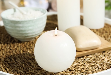 Photo of Spa composition with burning candle on table