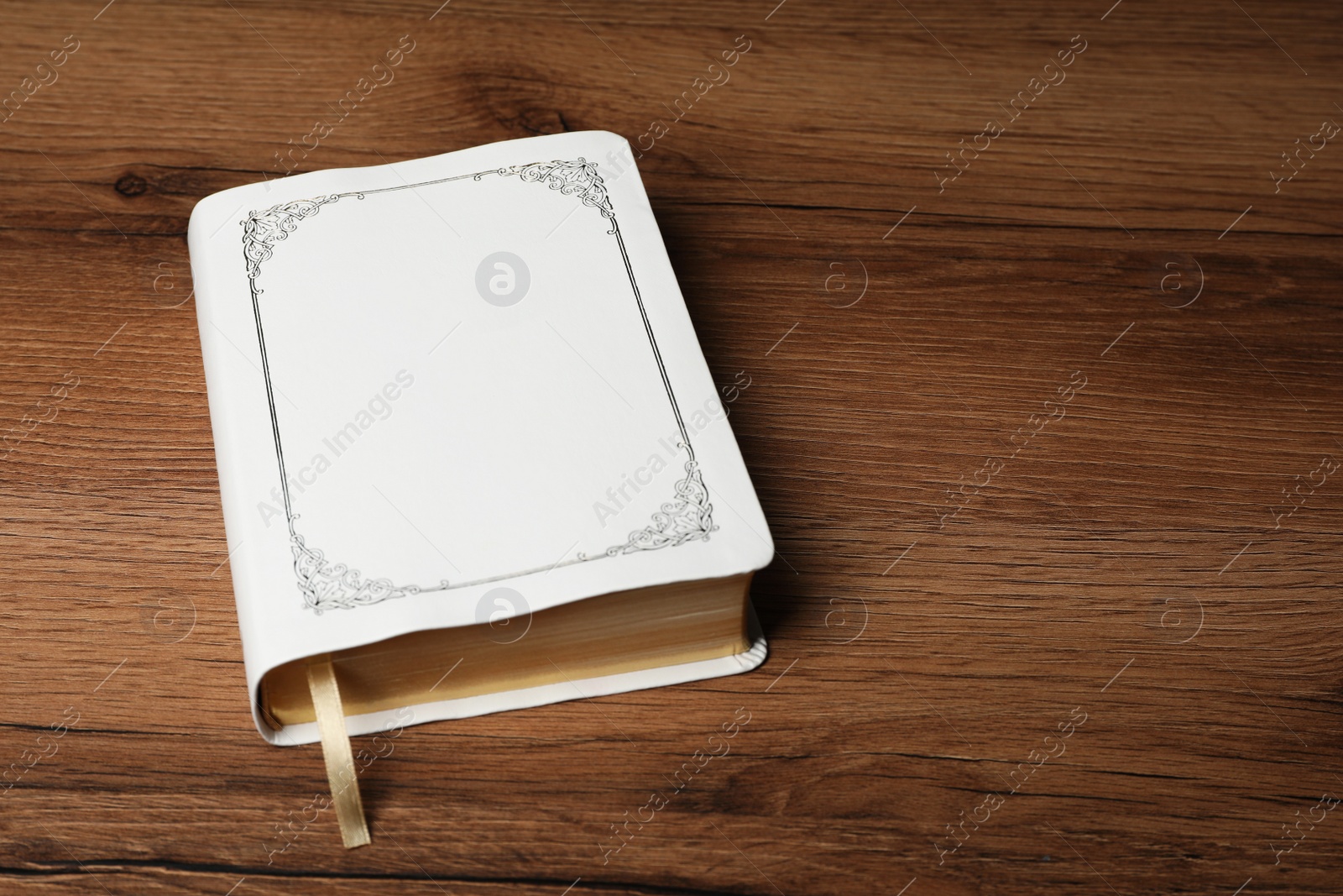 Photo of Bible on wooden table. Christian religious book