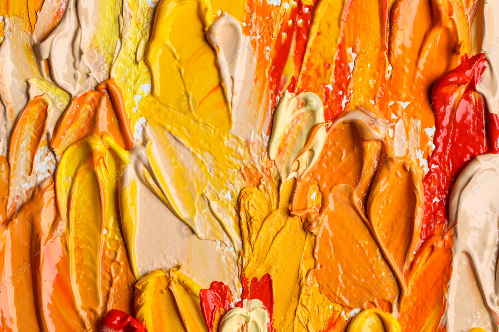 Photo of Beautiful strokes of colorful oil paints as background, closeup