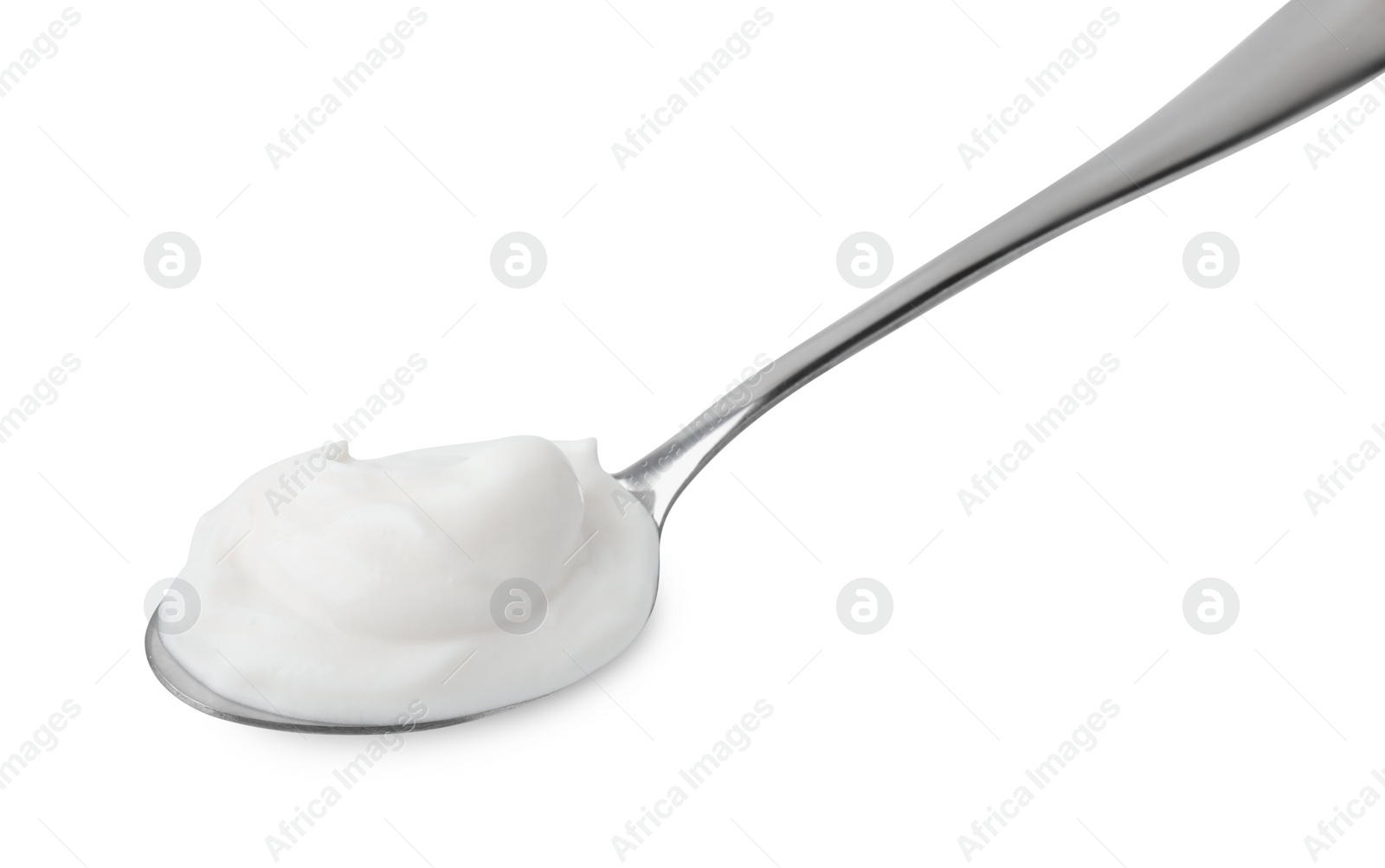 Photo of Delicious natural yogurt in spoon isolated on white