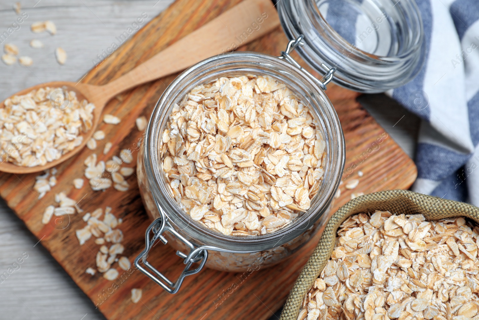 Photo of Oatmeal on white wooden table, flat lay