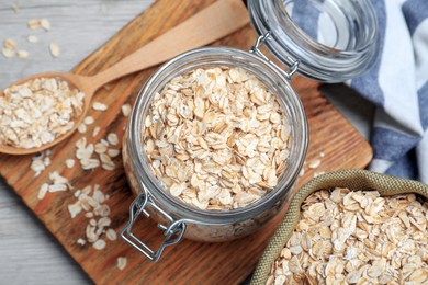 Photo of Oatmeal on white wooden table, flat lay