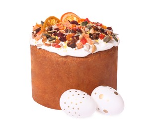 Photo of Traditional Easter cake with dried fruits and painted eggs isolated on white