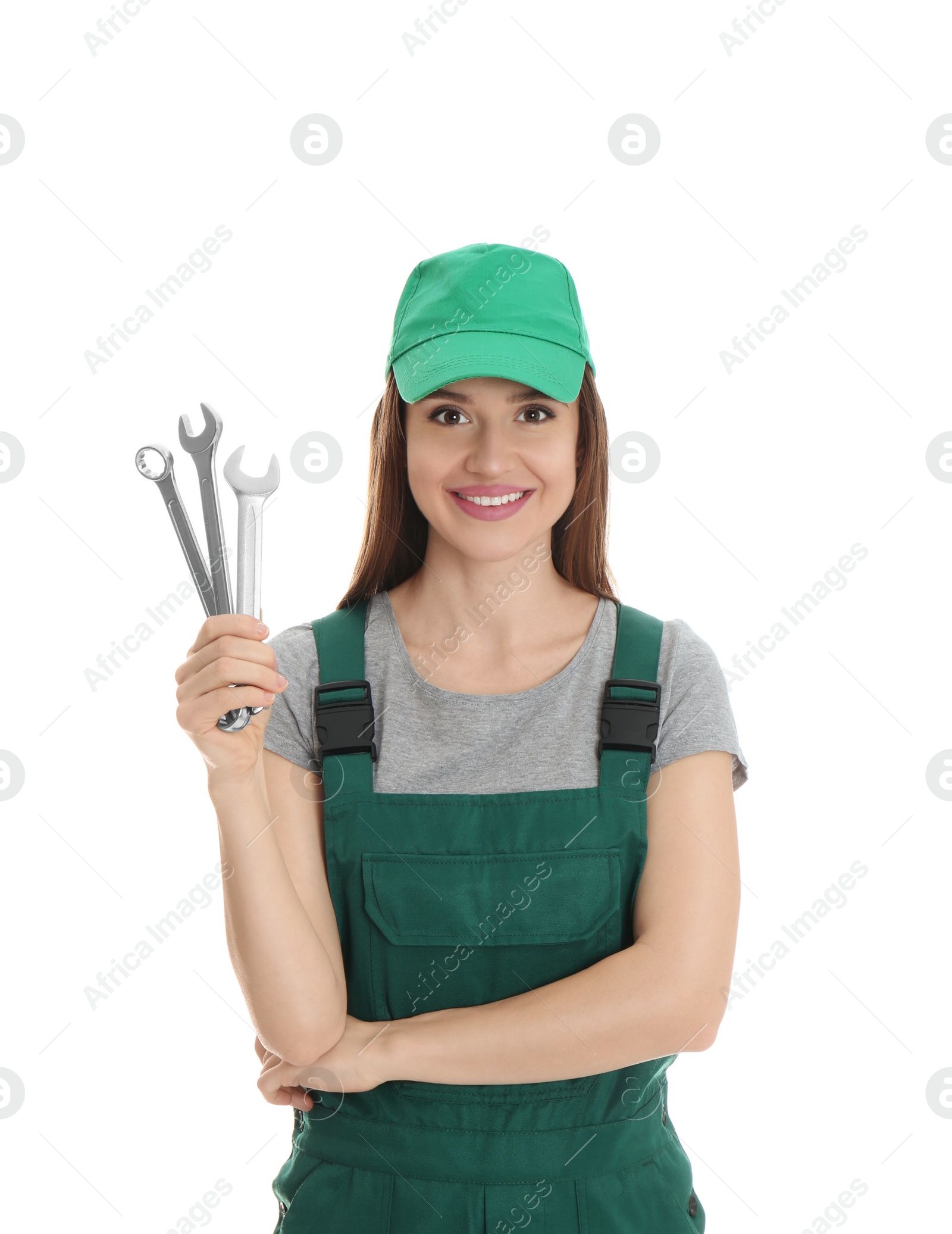 Photo of Portrait of professional auto mechanic with wrenches on white background