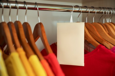 Scented sachet and clothes hanging in wardrobe