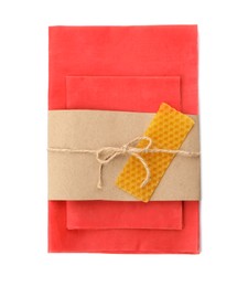 Reusable beeswax food wraps on white background, top view