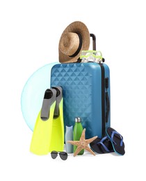 Suitcase, inflatable ring and other beach accessories isolated on white