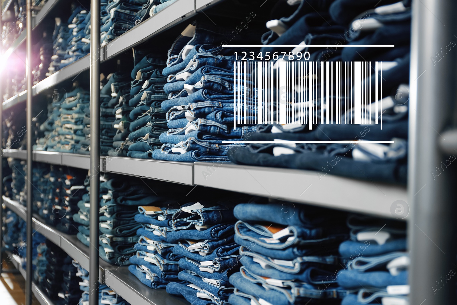 Image of Barcode and collection of stylish jeans on shelves in wholesale shop