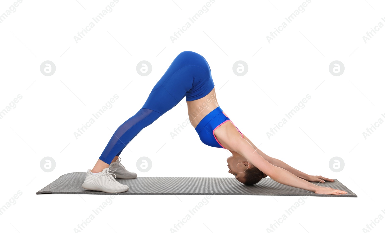 Photo of Young woman practicing yoga on white background