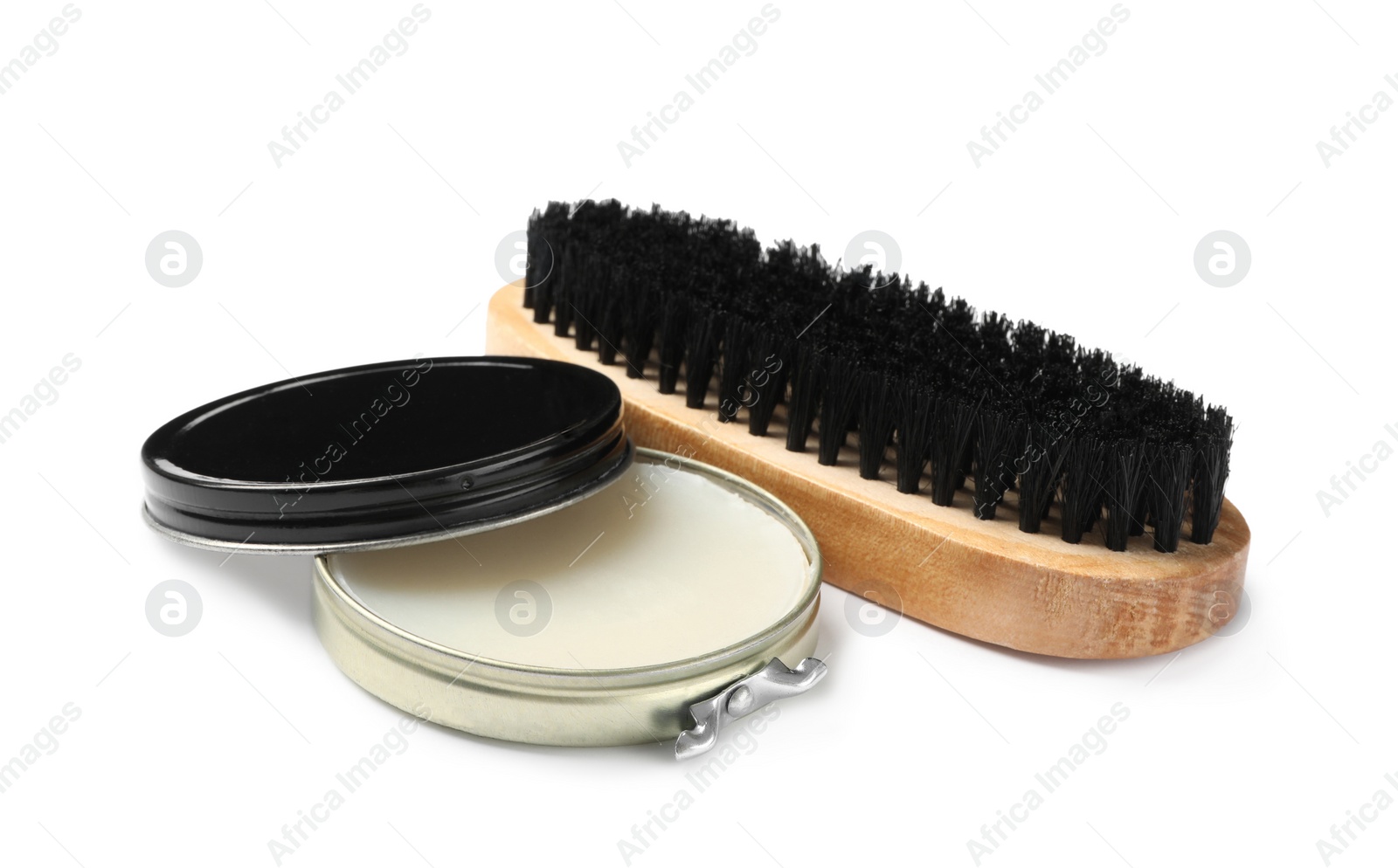 Photo of Wax polish with brush on white background. Shoe care accessories