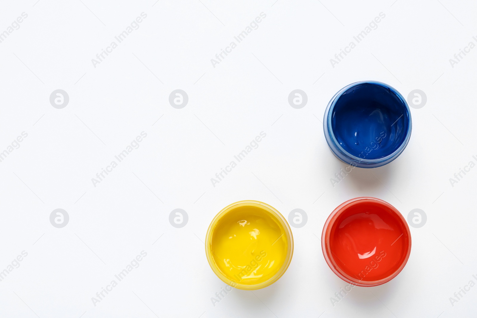 Photo of Composition with paints on white background, top view