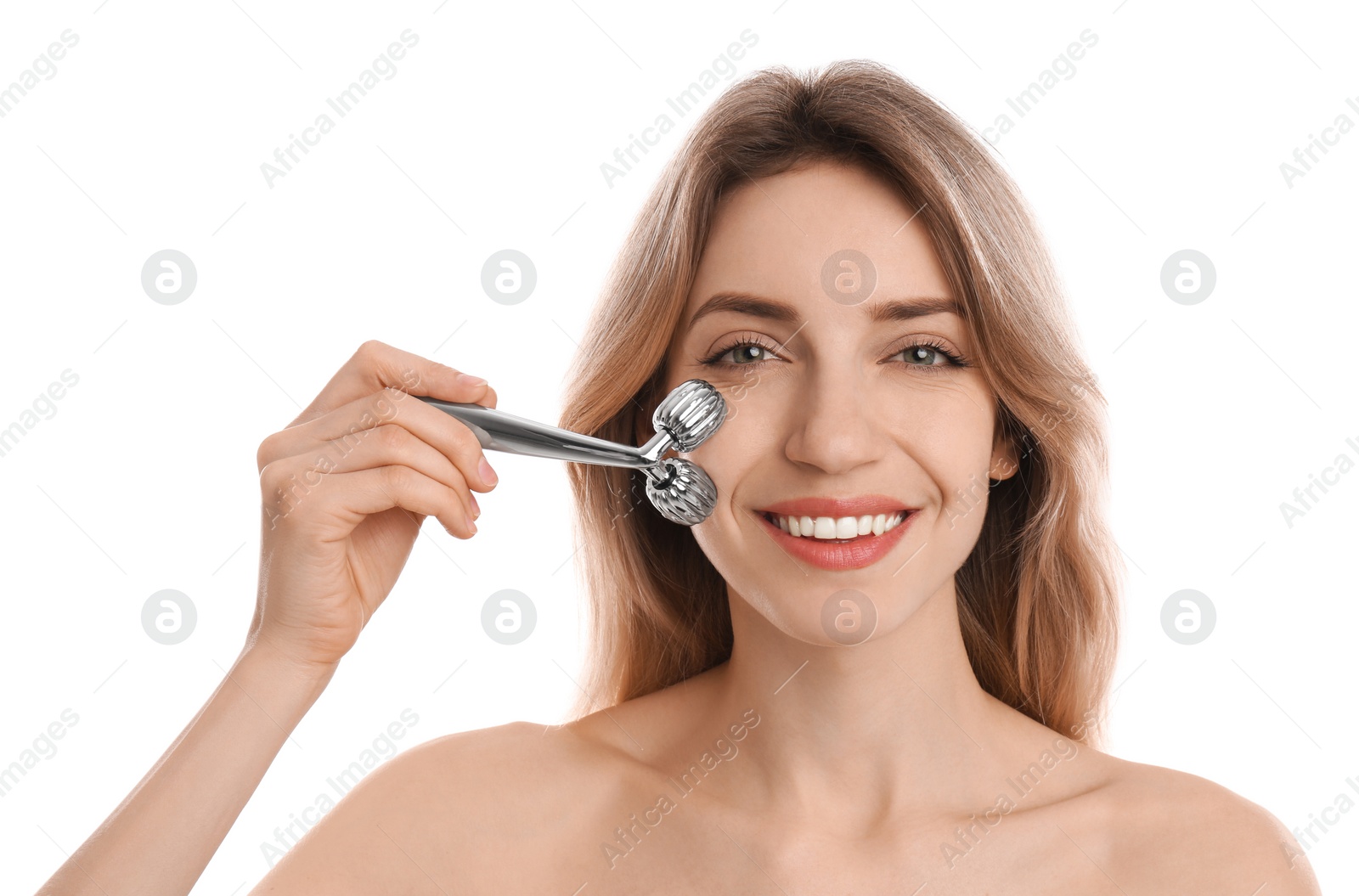 Photo of Young woman using metal face roller on white background