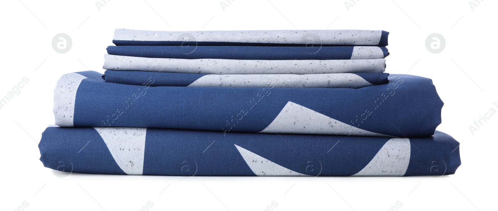 Photo of Stack of clean bed linens isolated on white. Child's room interior element