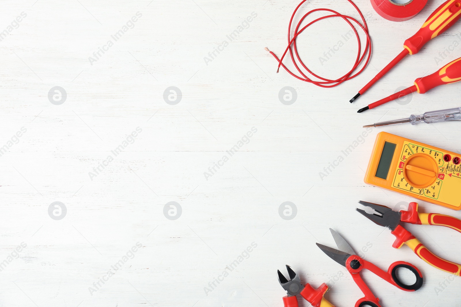 Photo of Flat lay composition with electrician's tools and space for text on wooden background