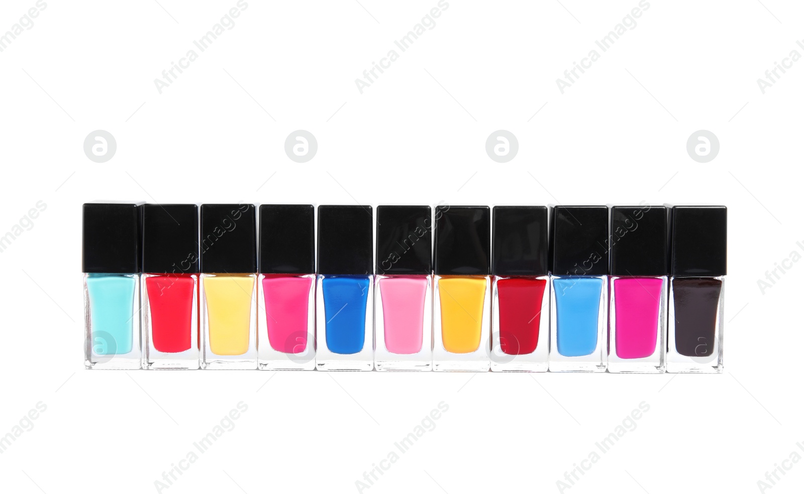 Photo of Bottles of nail polish on white background