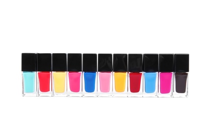 Bottles of nail polish on white background