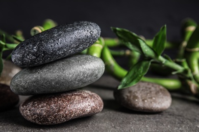 Photo of Composition with stones and bamboo on table. Zen concept