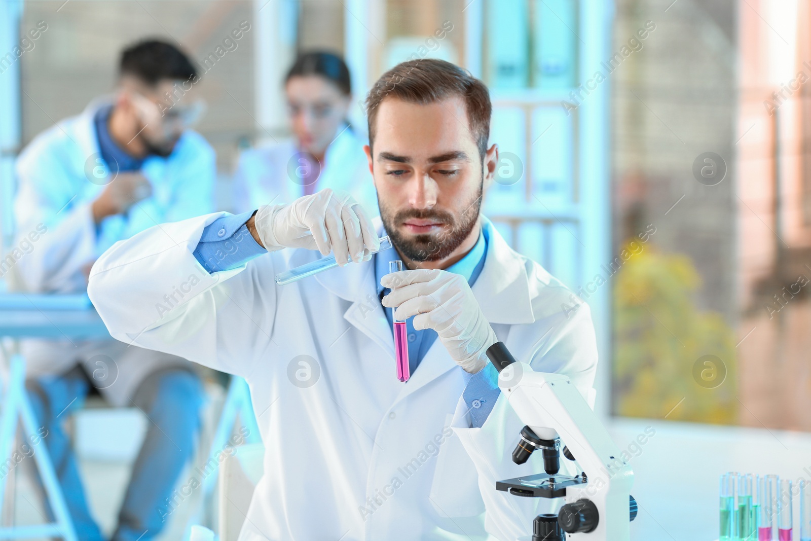 Photo of Young scientist working in laboratory. Chemical analysis