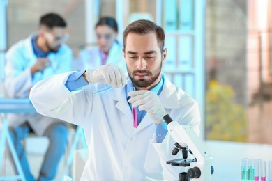 Young scientist working in laboratory. Chemical analysis