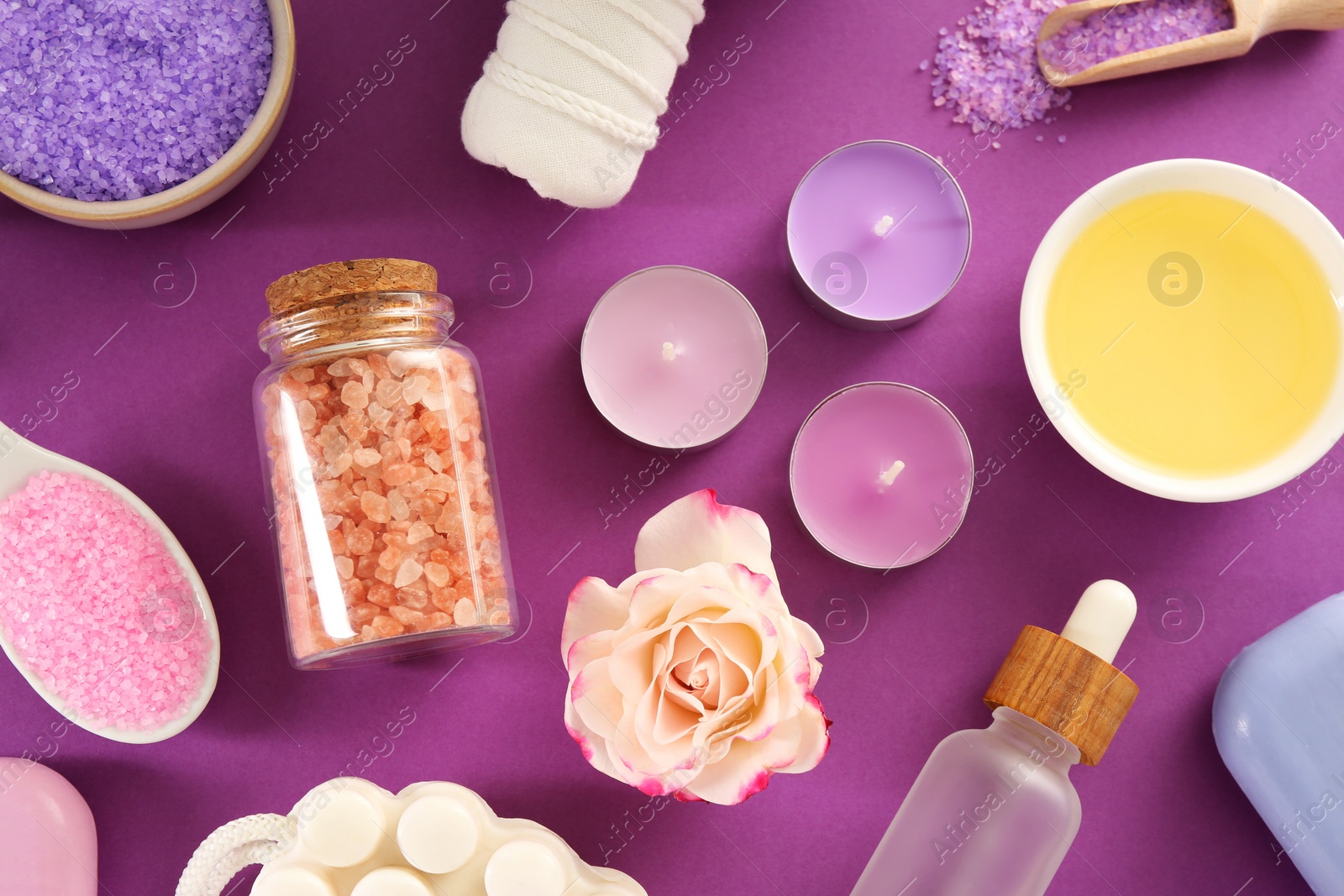 Photo of Flat lay composition with aromatic sea salt on purple background