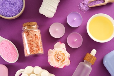 Flat lay composition with aromatic sea salt on purple background