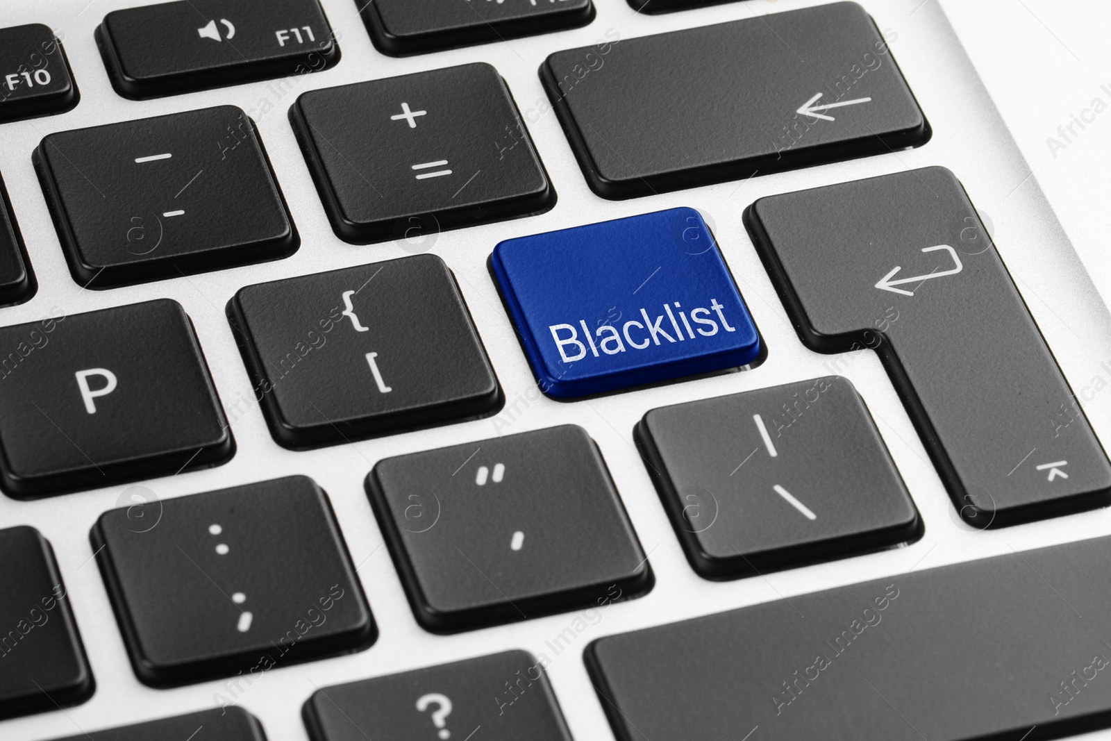 Image of Blue button with word Blacklist on laptop keyboard, closeup
