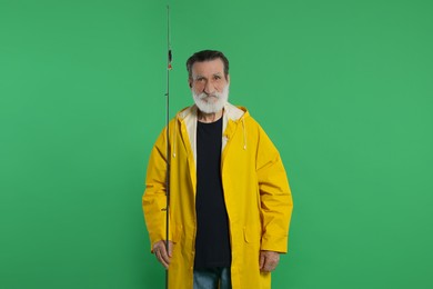 Fisherman with fishing rod on green background