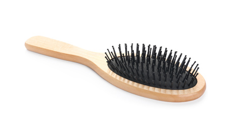 Photo of New wooden hair brush isolated on white