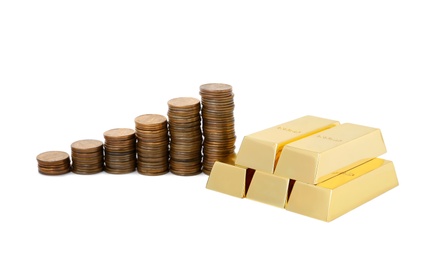 Shiny gold bars and coins on white background