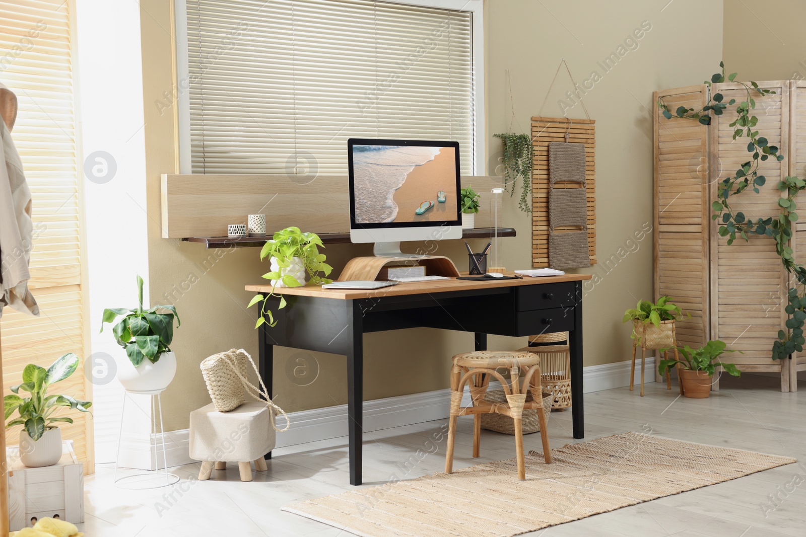 Photo of Light room interior with comfortable workplace near window
