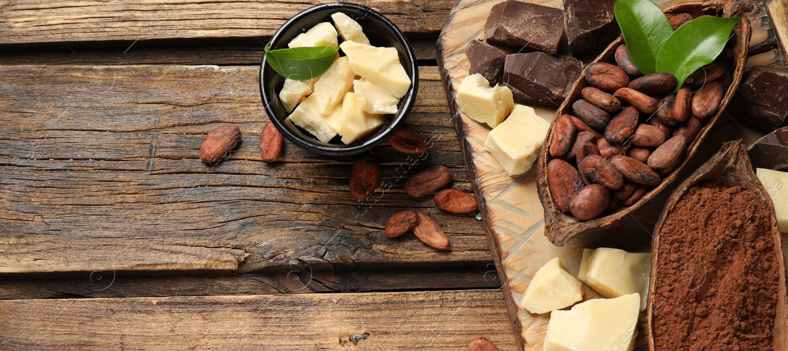 Photo of Flat lay composition with organic cocoa butter on wooden table. Space for text