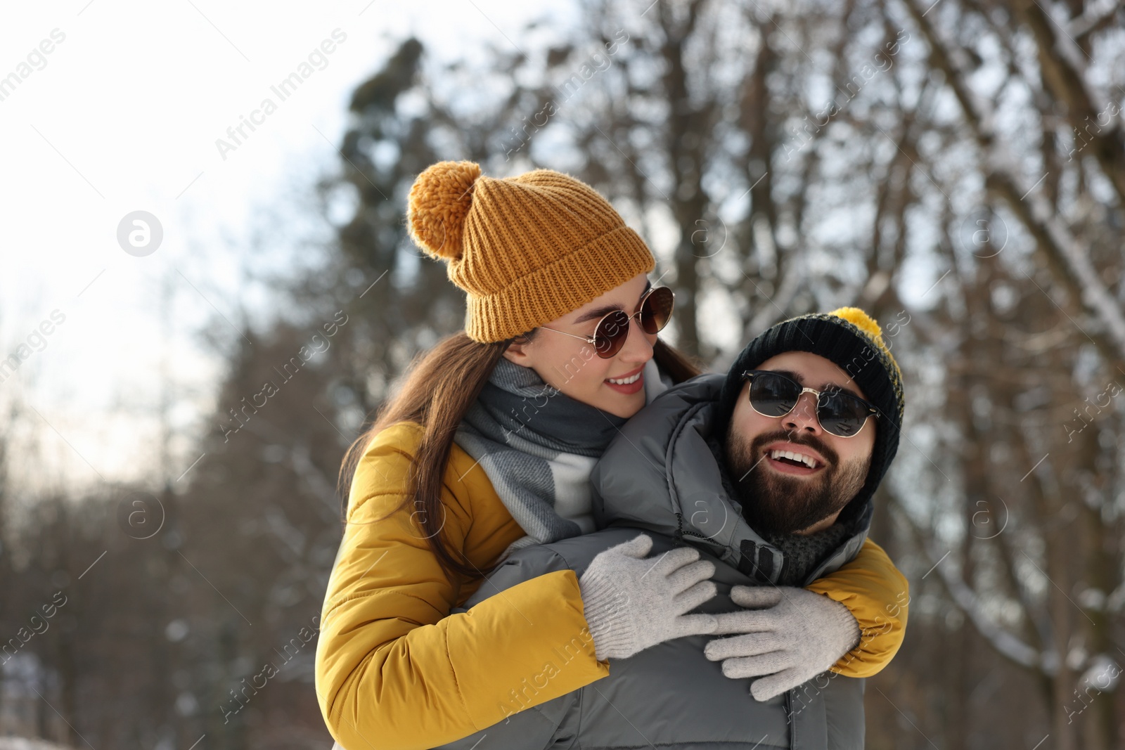 Photo of Happy young couple having fun outdoors on winter day