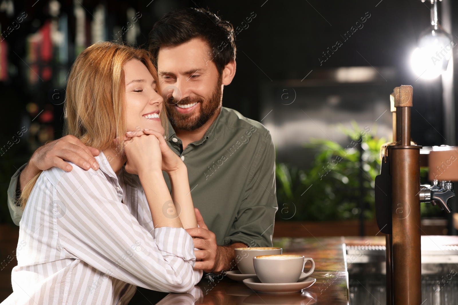 Photo of Romantic date. Happy couple spending time together in cafe