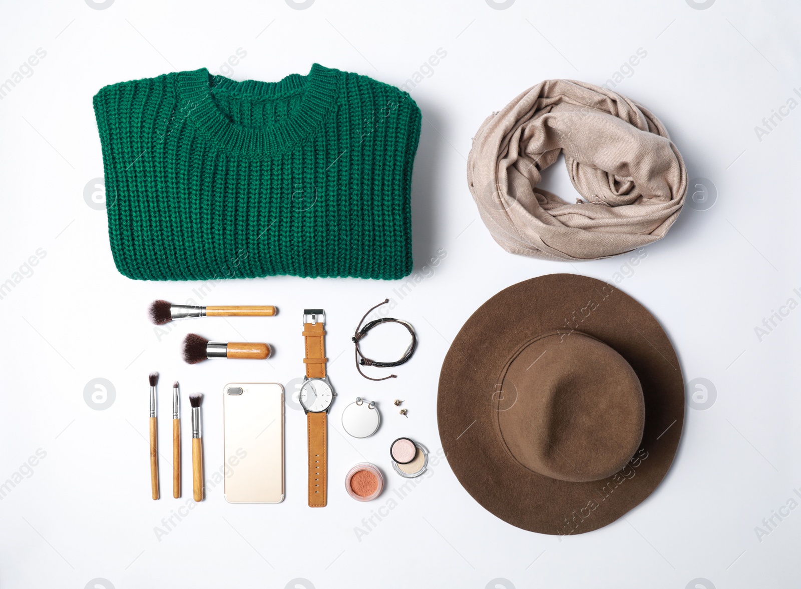 Photo of Stylish female autumn outfit and accessories on white background, flat lay. Trendy warm clothes