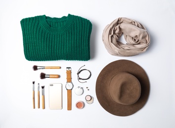 Stylish female autumn outfit and accessories on white background, flat lay. Trendy warm clothes